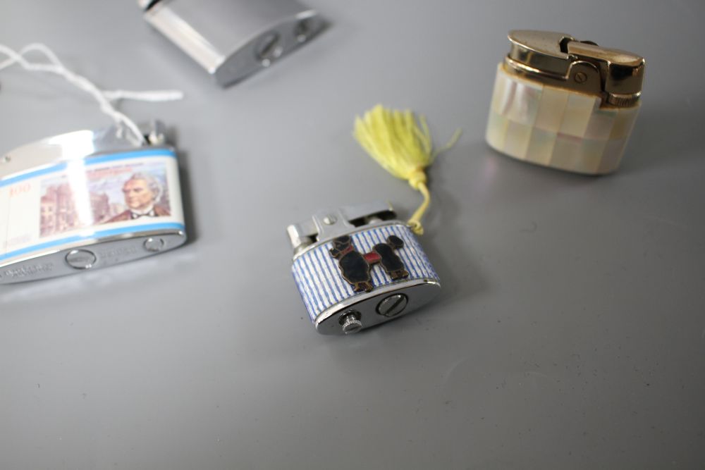 Four assorted ladys and gentlemans base metal cigarette lighters including Ronson mother of pearl and Brother-Lite, largest 55mm.